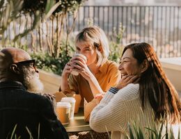 A group of coworkers enjoy an outdoor lunch