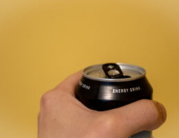Hand holding energy drink