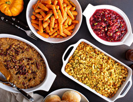 Platters of thanksgiving food on a table