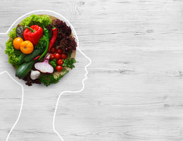 girl outline with healthy food creating her brain