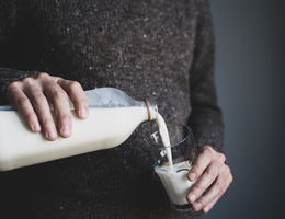 Man pouring a glass of milk