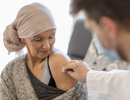 Patient with cancer receiving vaccination