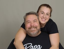 Adam and Roseanna Brown posing and smiling together