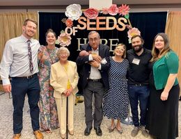 Ester Boloix-Chapman, third from right, celebrates with her family after receiving the Behavioral Health Champion Award. Ester with family at Seeds of Hope event after receiving Behavioral Health Champion Award