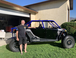 Eric Nelson poses with his off-roading vehicle.
