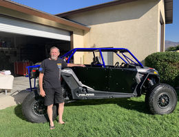 Eric Nelson poses with his off-roading vehicle.