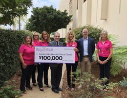 Stater Bros. Charities and Inland Women Fighting Cancer present a $100,000 check to LLU Cancer Center