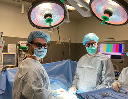 two male doctors in operating room