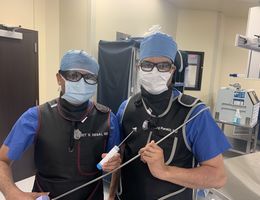 From left, cardiologists Harit Desai, MD, and Niraj Parekh, MD, hold surgical equipment used to repair patients’ heart valves during TMVr — a procedure that saved Elenita Tan’s life in December 2020.