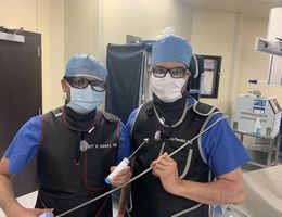 From left, cardiologists Harit Desai, MD, and Niraj Parekh, MD, hold surgical equipment used to repair patients’ heart valves during TMVr — a procedure that saved Elenita Tan’s life in December 2020. From left, cardiologists Harit Desai, MD, and Niraj Parekh, MD, hold surgical equipment used to repair patients’ heart valves during TMVr — a procedure that saved Elenita Tan’s life in December 2020.