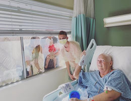 Family visits Jill Burkhart during her hospital stay.