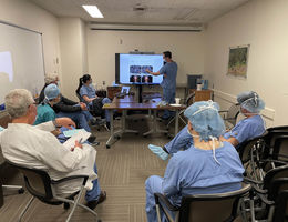 Team of specialists assembled in a room analyze images