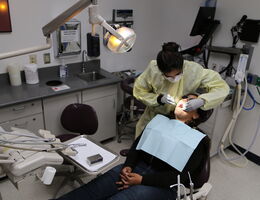 Dental patient sits in chair for treatment at LLU pediatric dental clinic