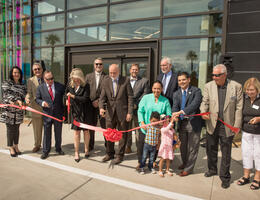 Group of people just after ribbon is cut