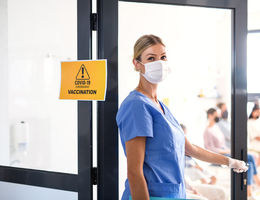 Portrait of nurse with face mask looking at camera, coronavirus, covid-19 and vaccination concept