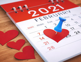 Calendar with heart pinned to it
