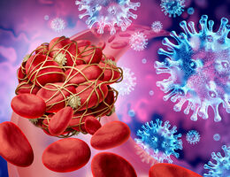 Illustration of COVID-19 viral particles floating next to a blood clot