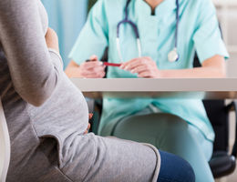 Close-up of a pregnant woman during medical visit