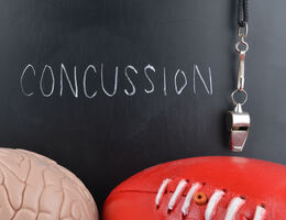blackboard with "concussion" in chalk writing 