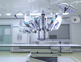 surgical robot in operating room above operating table