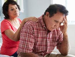 Wife comforting husband with dementia