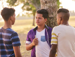 Young teens smoking outside