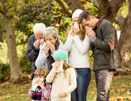 Sick family blowing their noses