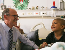 LLUCH physician Dr. Albert Kheradpour enjoys a moment of laughter while treating a patient at Loma Linda University Children’s Hospital.