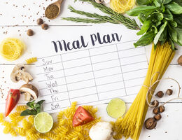 Pasta, vegetables, fruits and meal plan text. 