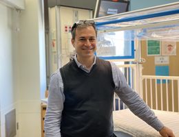 Dr. David Michelson poses for picture in PICU 