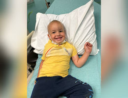 Boy receiving cancer treatment in hospital room