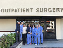 Group of female nurses in front of building