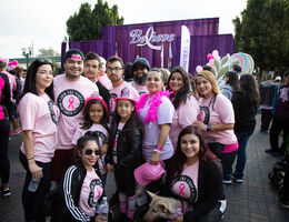 family standing in front a believe sign