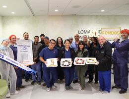 a group of medical employees pose for a photo