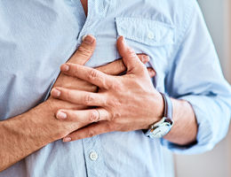 Man with hands on his chest