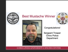 Slide announcing Sergeant Trosper of the Chino Police Department as Best Mustache Winner