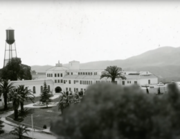 Nichol Hall on the School of Public Health Campus at Loma Linda University black and white photo of a university campus, hills in the background, trees in the foreground