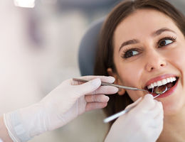 Dentists checks patients teeth