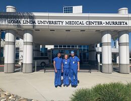 three surgeons standing