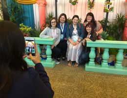 Conference attendees enjoyed bright, floral photo opportunities with friends.