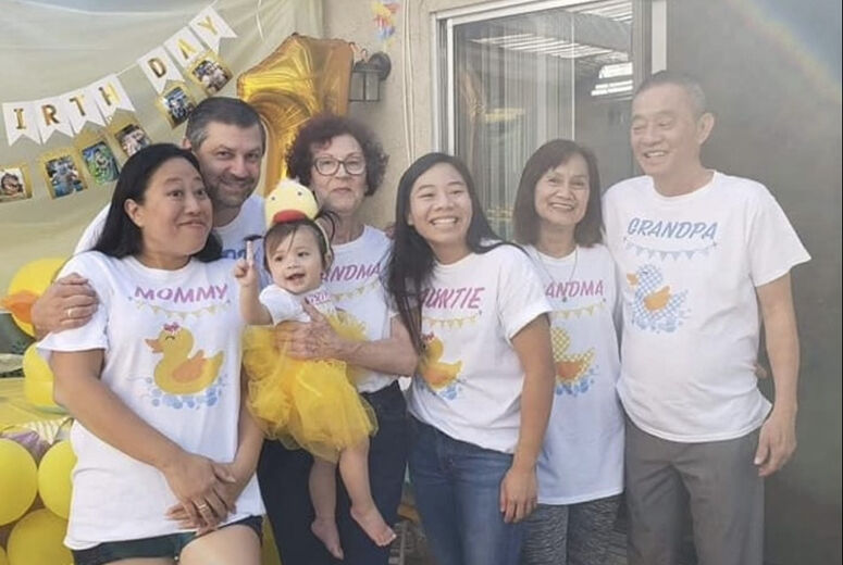 Pongsiri (right) with his family celebrating Ellie's first birthday