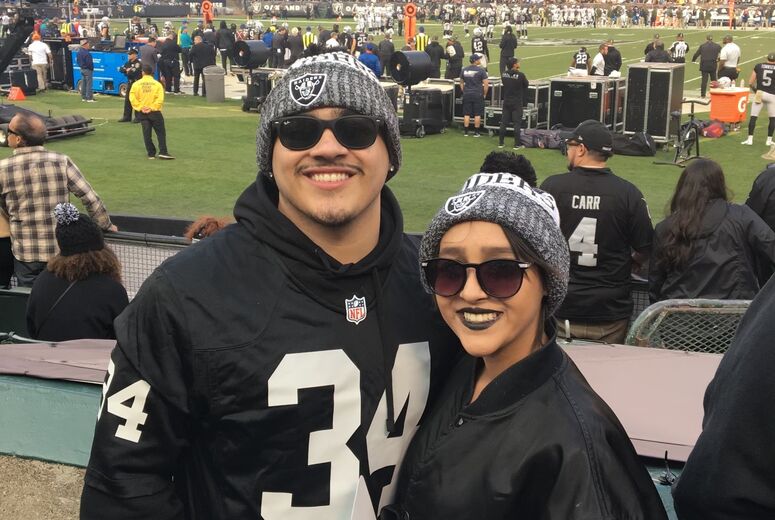 Melendrez and her brother at a Raiders game