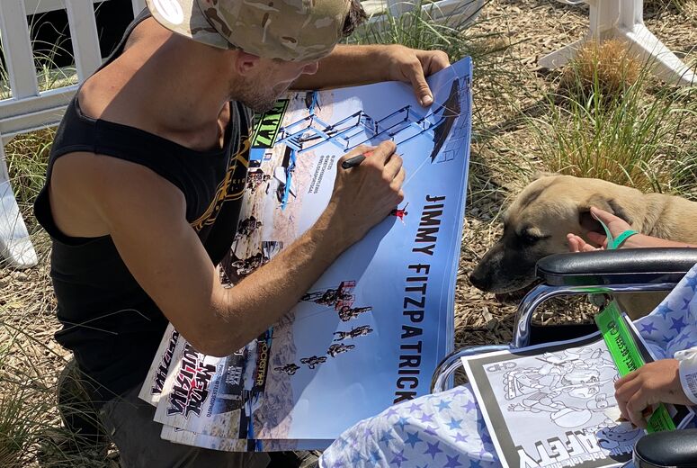 FMX rider signing autographs outside