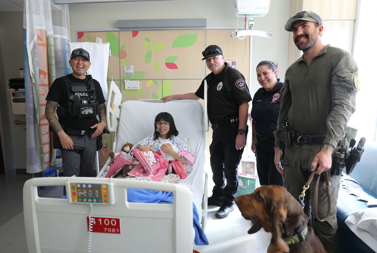 Officers surprise young patient with gifts and a happy birthday rendition for her 18th birthday