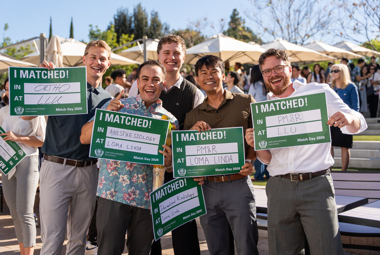 LLU Medical Students Holding Match Day Signs 