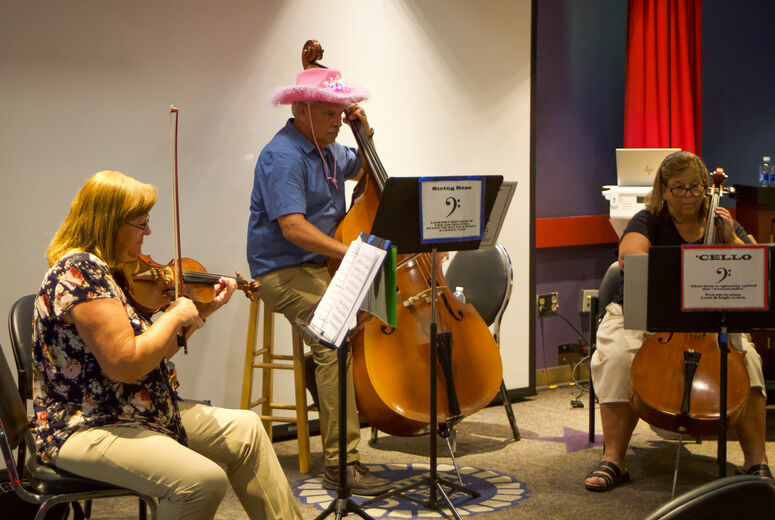 Becky Long & Friends play their string instruments