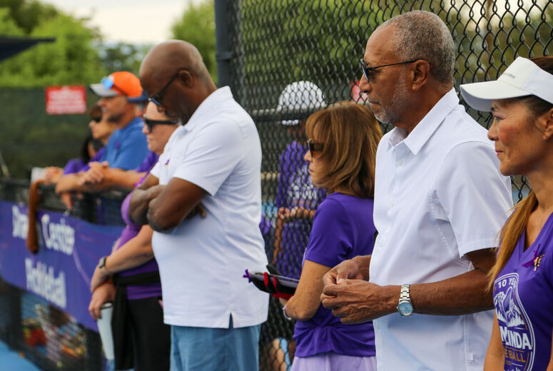 Attendees listen to tribute