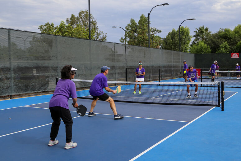 Players engage in a game of pickleball