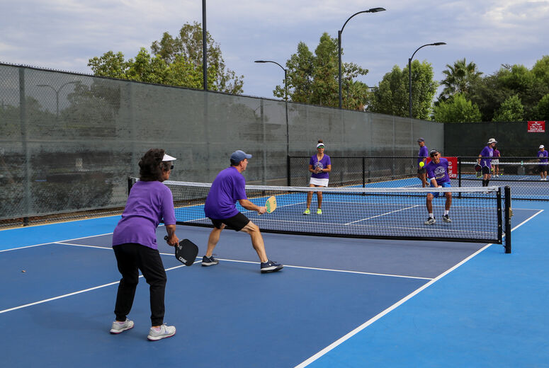Players engage in a game of pickleball