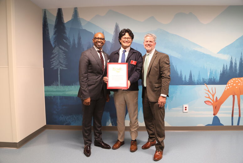 hospital leaders poses with state government representative